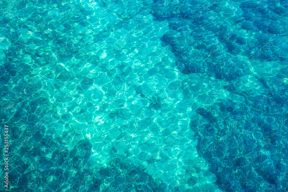 Crystal clear water in the port of Fiskardo, look from above