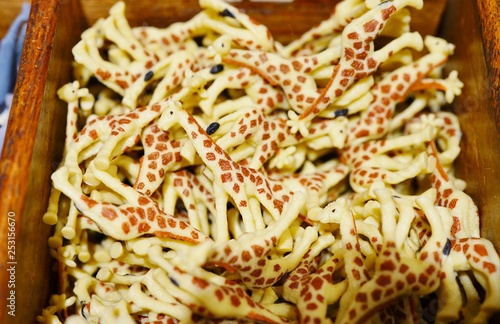 Canvas Print View of a bin filled with plastic giraffes in a toy store
