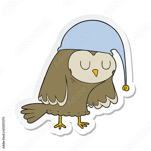 sticker of a cartoon owl sleeping