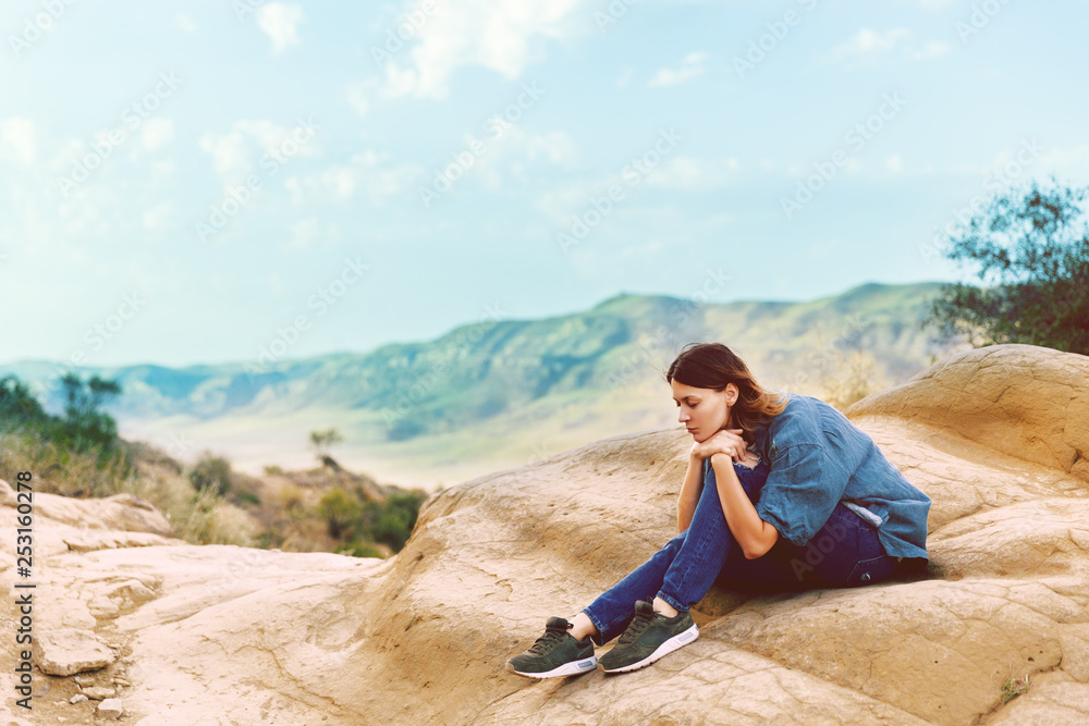 Beautiful young woman in the mountains. Mood. Nature. Meditation. Relax