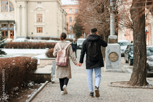 Wallking together. Full length of young couple on date having fun together