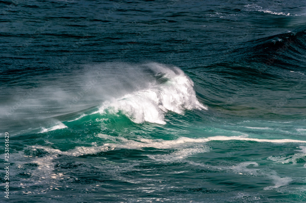 big ocean waves in windsy weather