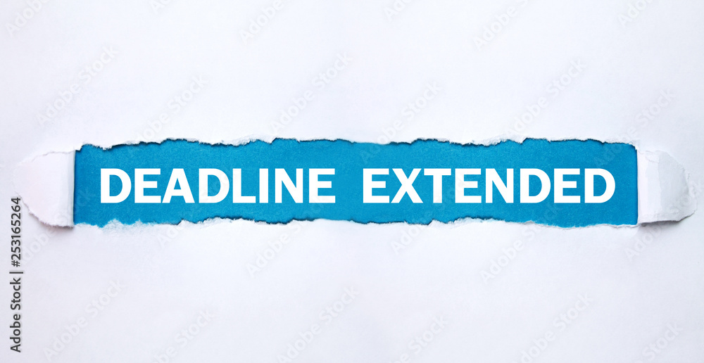 Deadline Extended text on torn paper. Deadline Extended text on torn paper.