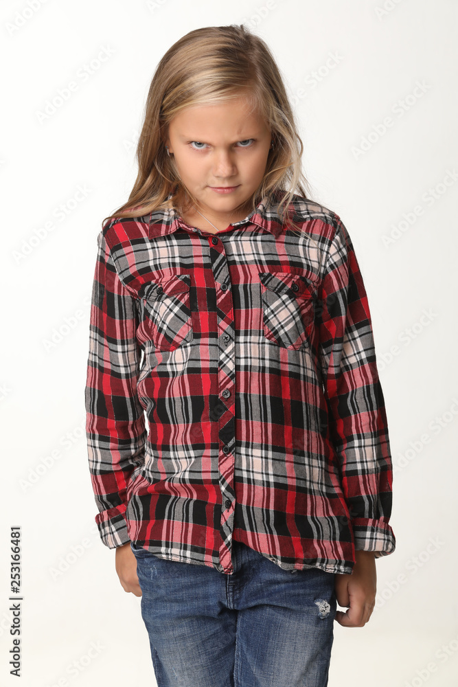 Portrait girl with an evil face expression with long blond hair. White background Portrait girl with an evil face expression with long blond hair. White background