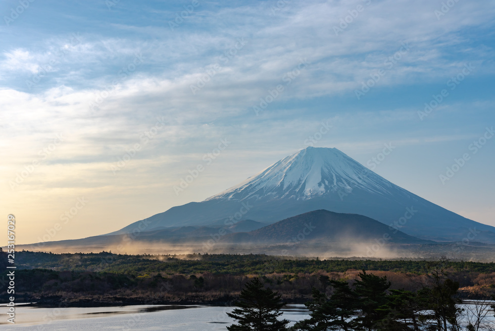 Landscape of Mount Fuji with natural fine sand flying up in the air. The World Heritage. view at Lake Shoji ( Shojiko ) in the morning. Fuji Five Lake region, Minamitsuru District, Yamanashi, Japan.