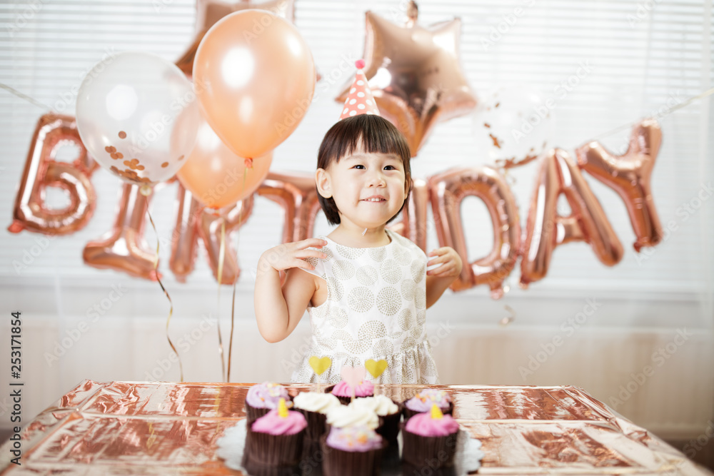 toddler girl celebrating her third birthday at home toddler girl celebrating her third birthday at home