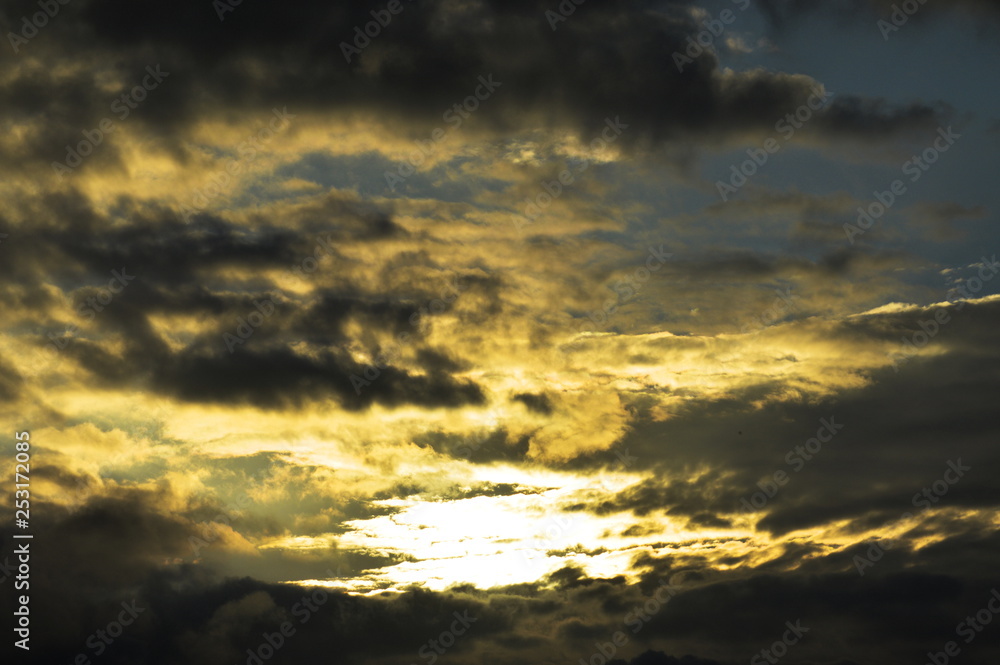 Fototapeta premium Dark clouds in a sunny sky