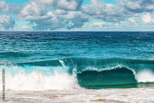 Beautiful clouds and breaking ocean wave - scenic seascape of Australia