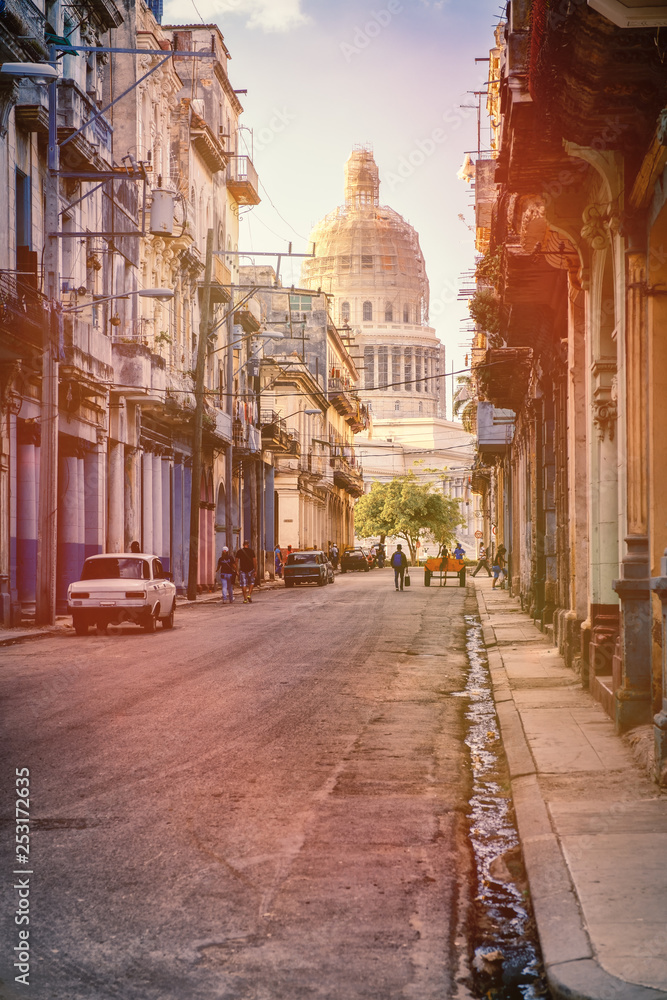 Street scene in Havana with old buildings and the Capitol