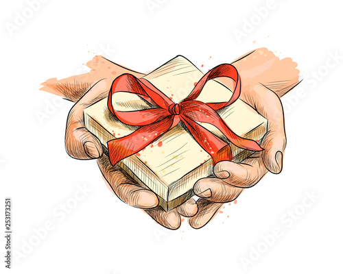 Female hands holding a small gift wrapped with red ribbon