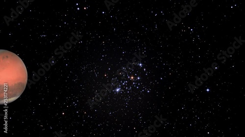 Planet Mars orbiting through stars from left to right