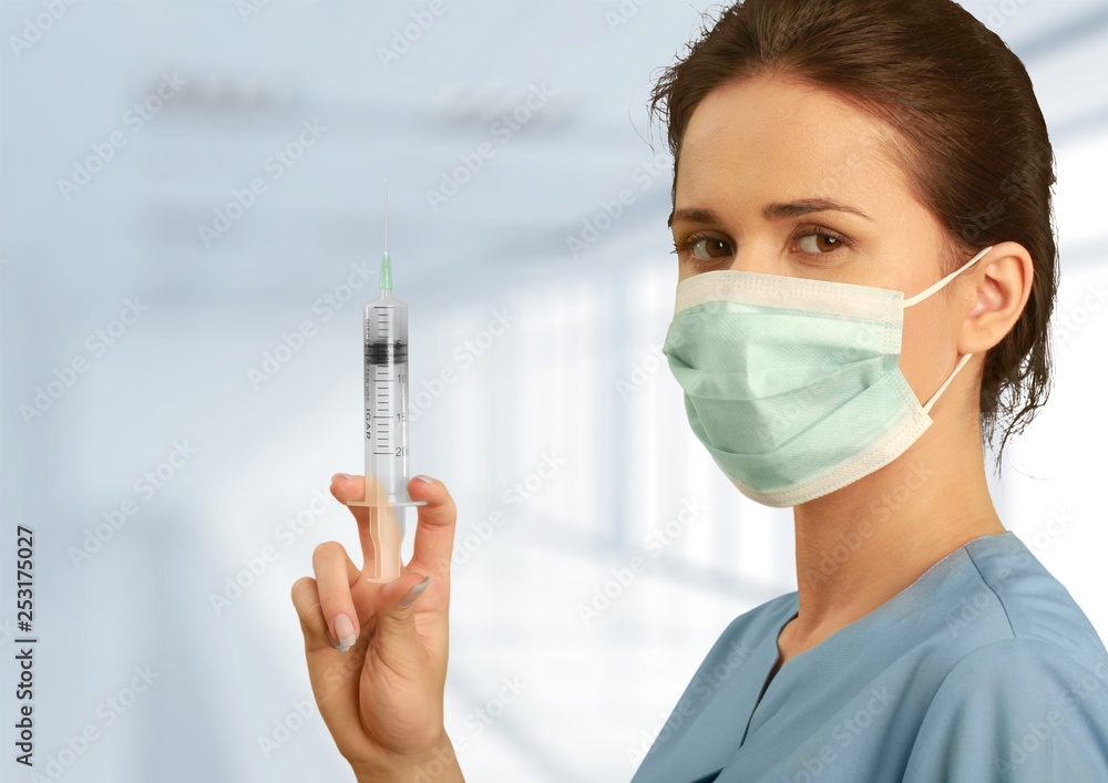 Young female scientist standing in her lab. Young female scientist standing in her lab.