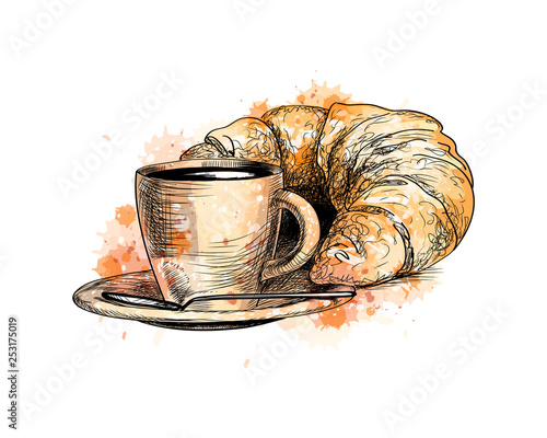 Cup of coffee and a croissant