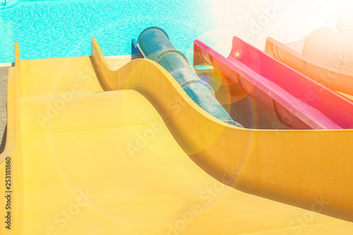 Stylishly interesting water slide in the pool near the sea on nature background