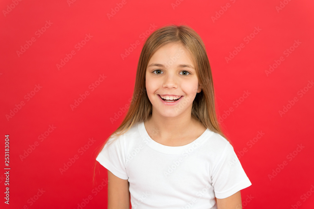 Smiling beauty. Brilliant smile concept. Girl happy smiling face over red background. Emotional kid cute smiling face. Sincere emotion. Cheerful adorable girl smiling. Positive and optimistic Smiling beauty. Brilliant smile concept. Girl happy smiling face over red background. Emotional kid cute smiling face. Sincere emotion. Cheerful adorable girl smiling. Positive and optimistic