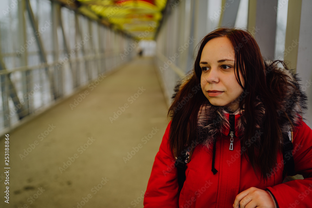 Fototapeta premium Beautiful girl on the bridge, looking into the distance