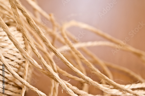 Photos Tangled string on wooden table.