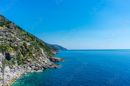 Italy, Cinque Terre, Vernazza, Vernazza, SCENIC VIEW OF SEA AGAINST CLEAR BLUE SKY © SkandaRamana