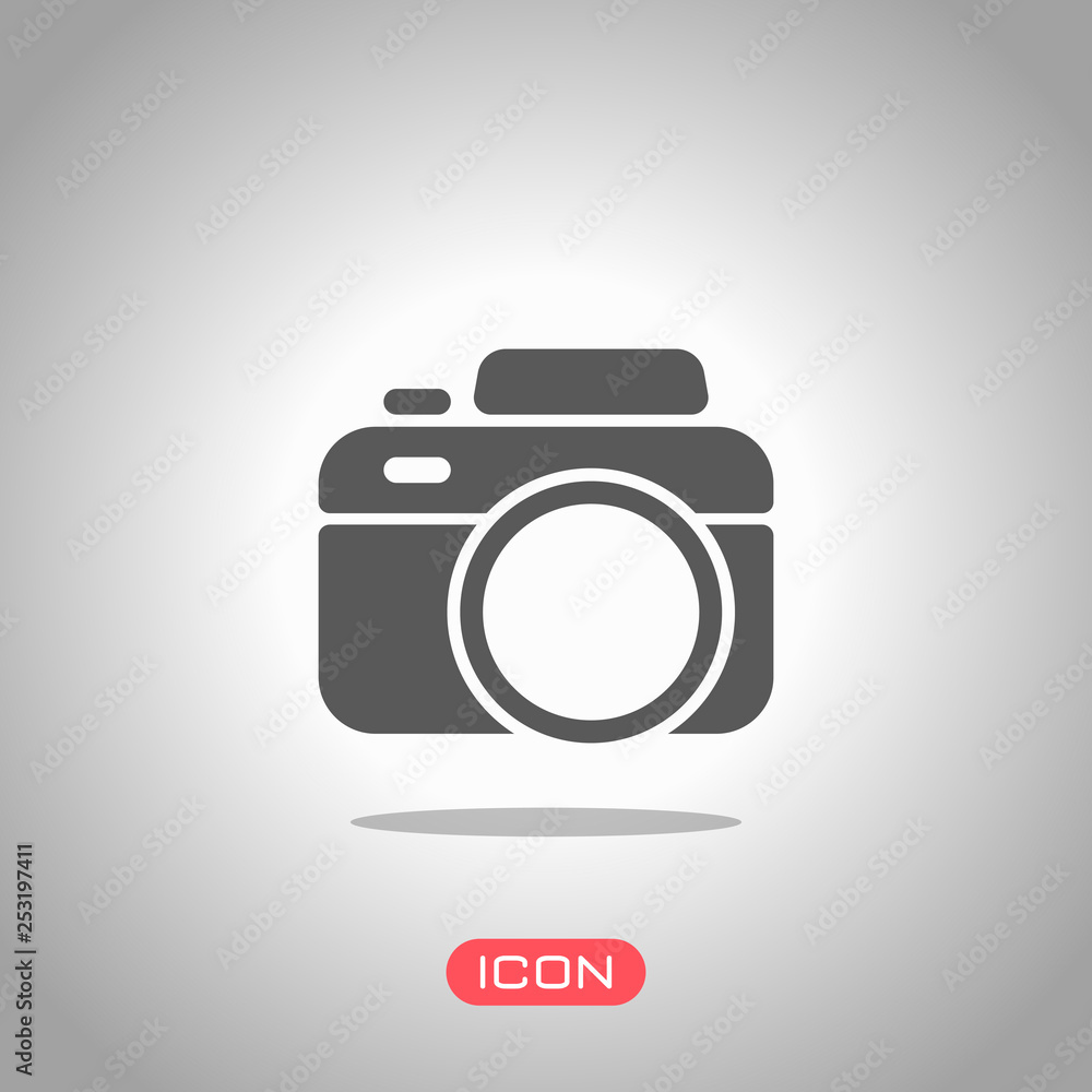 Photo camera, simple icon. Icon under spotlight. Gray background