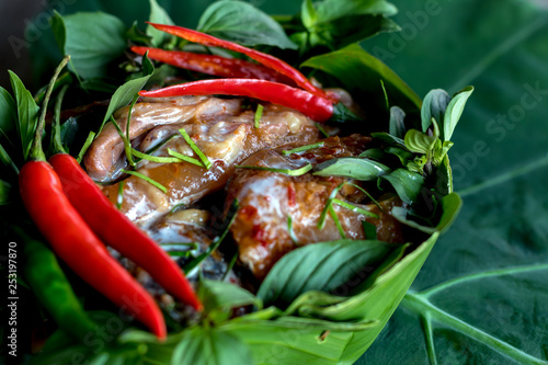 Raw fish wrapped in banana leaves.