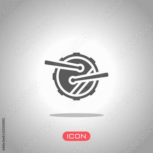 Drum icon. Simple music instrument with drumsticks. Icon under spotlight. Gray background