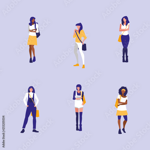 beautiful interracial girls group modeling with handbag