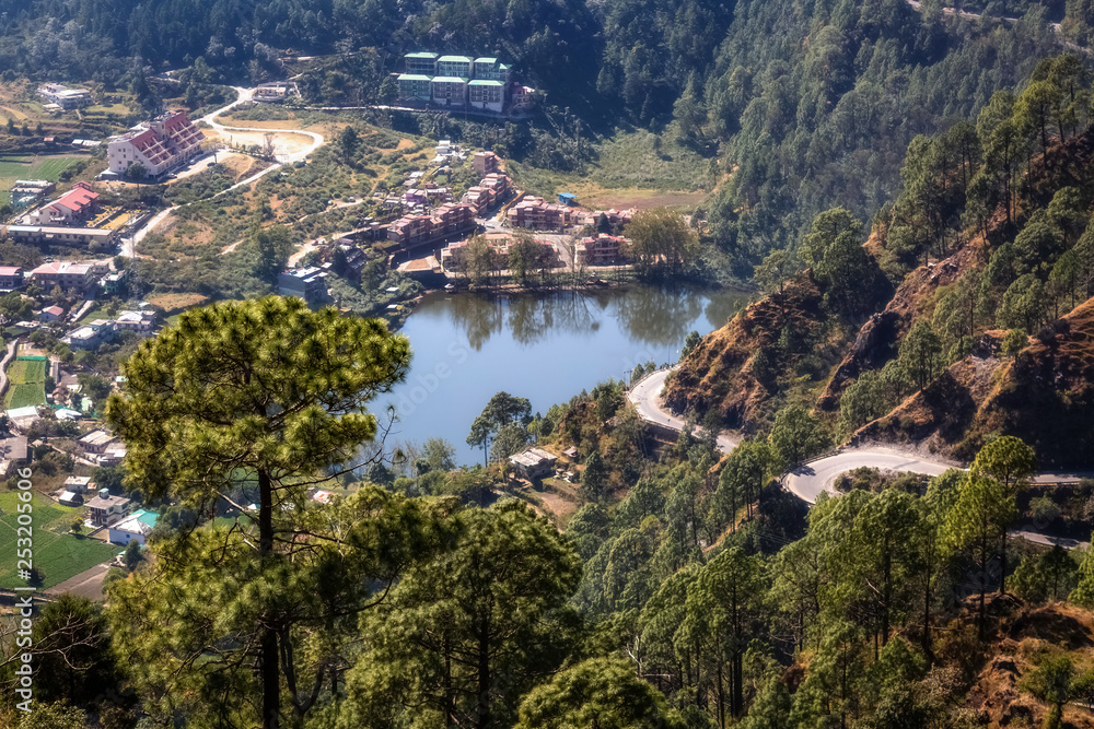 Scenic mountain lake aerial view with cityscape as seen from a mountain top at Munsiyari Uttarakhand India. 
