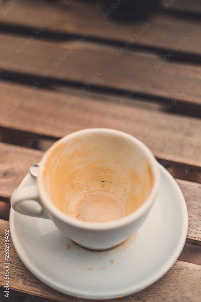 cup of coffee on wooden table cup of coffee on wooden table