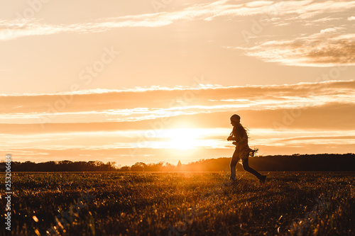 silhouette of woman at sunset