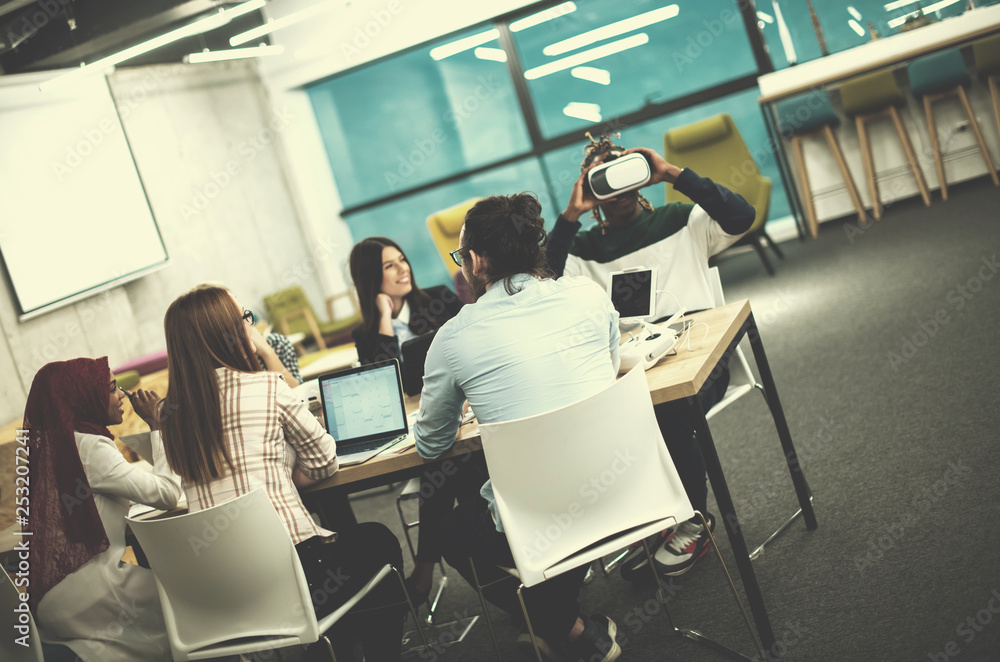 Young Multiethnic Business team using virtual reality headset Young Multiethnic Business team using virtual reality headset