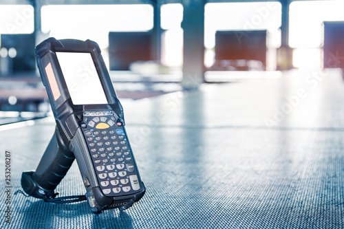 barcode scanner on conveyor belt in distribution warehouse.