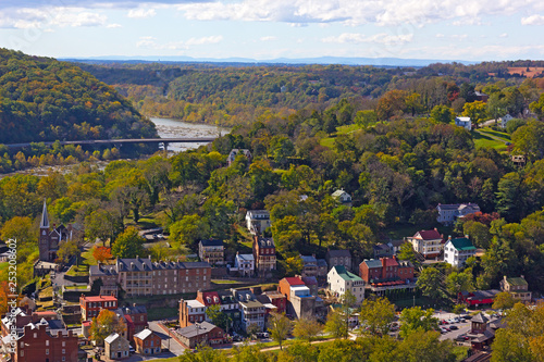 A view on Harpers Ferry National Historic Park and town with railroad station. West Virginia landscape in autumn at the point where Potomac and Shenandoah rivers meet. photo