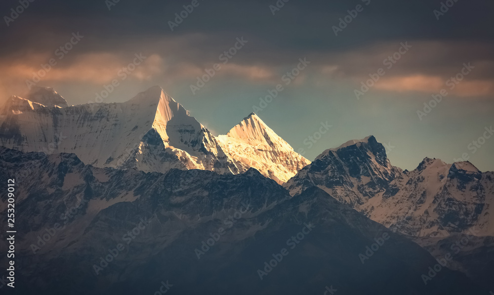 Himalayan peaks Nanda Devi and Nanda Khat at sunset as viewed on trek at Uttarakhand India.