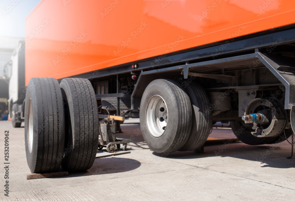 Semi truck repairing truck tire. Semi truck repairing truck tire.