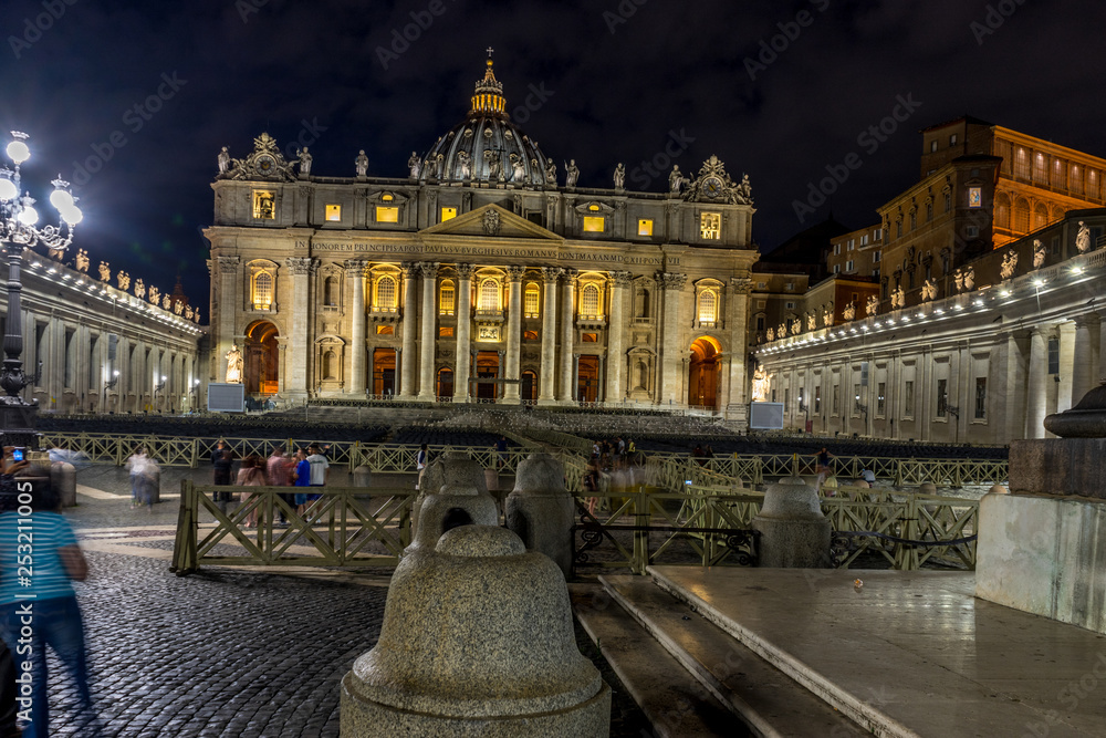 Vatican City,Italy - 23 June 2018: St.Peters Basilica is illuminated with lights at night in Vatican city in the square with moonlight at night