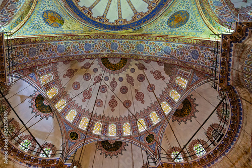 Ceramic Blue tile with colorful patchwork dome and praying area, interior side view Blue Mosque.