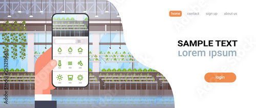 hand holding smartphone using smart control farming system mobile application organic hydroponic green plants row cultivation farm modern greenhouse interior horizontal copy space