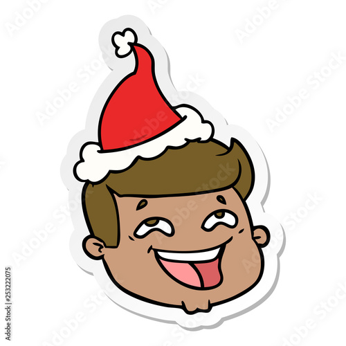 happy sticker cartoon of a male face wearing santa hat