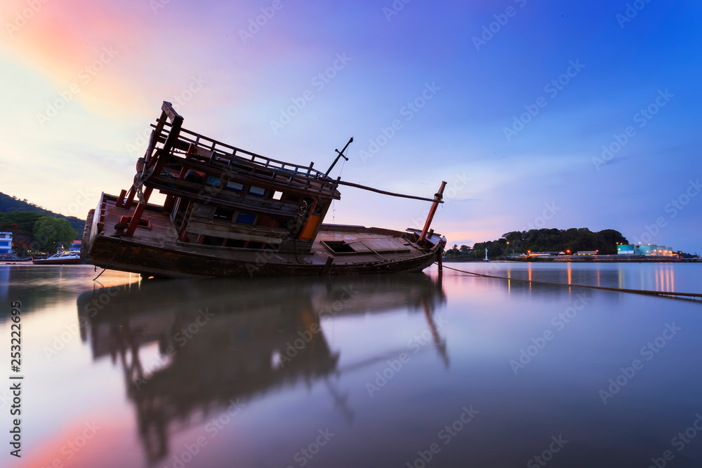 old fishing boat at sunset