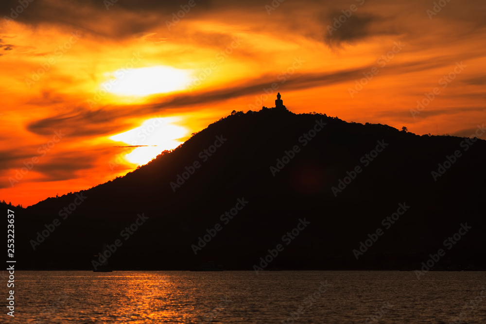 silhouette of big buddha at sunset