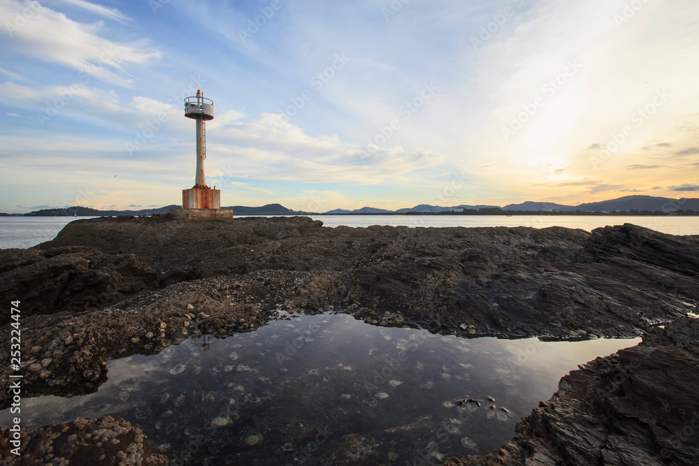 cross on top of hill at sunset