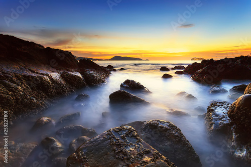 sunset on coast of sea © browneyefoto