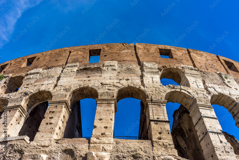 Facade of the Great Roman Colosseum (Coliseum, Colosseo), also known as the Flavian Amphitheatre. Famous world landmark