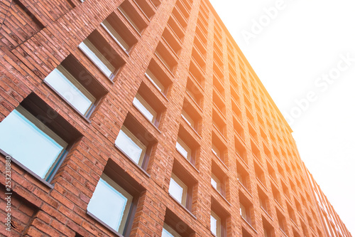 Square windows in a red brick building