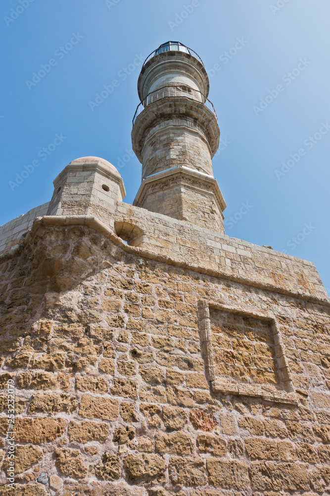 Lighthouse at the old Venetian harbor, city of Chania, Crete island, Greece Lighthouse at the old Venetian harbor, city of Chania, Crete island, Greece