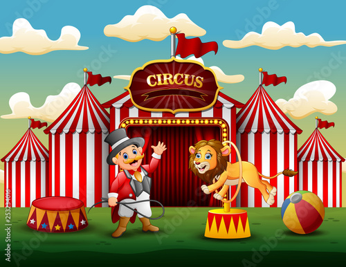 Cartoon lion jumping through ring on the arena