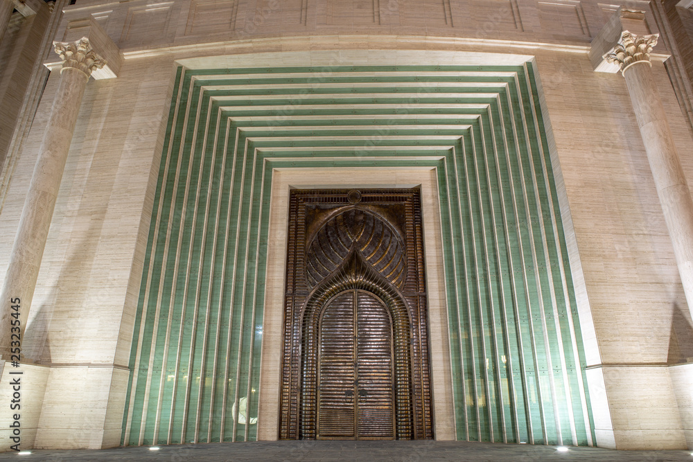 DOHA, QATAR – JULY 13 2013: Huge bronze door of amphitheater in Katara Cultural Village, Doha Qatar.. DOHA, QATAR – JULY 13 2013: Huge bronze door of amphitheater in Katara Cultural Village, Doha Qatar..