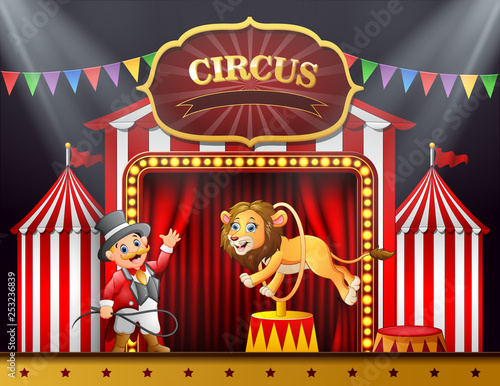 Cartoon lion jumping through ring on the stage arena