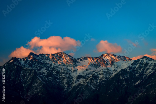 The last light of the day shining bright on the snow covered Himalayan peaks