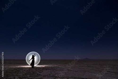 Clear blue starry night skies composed with light painting technique in the dry salt lake of Sambhar, Rajasthan